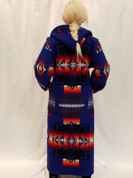 Long wool coat, sapphire blue with red, orange and back geometric accents in the Chief Joseph pattern.