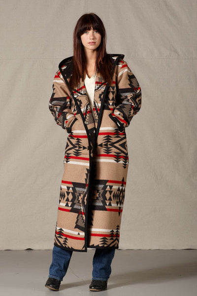 Long Pendleton wool coat, mostly tan with black geometric shapes and red accents.