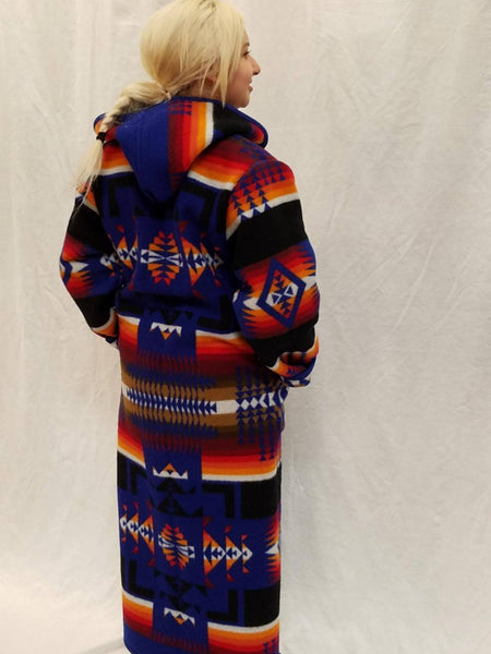 Long wool coat, sapphire blue with red, orange and back geometric accents in the Chief Joseph pattern.