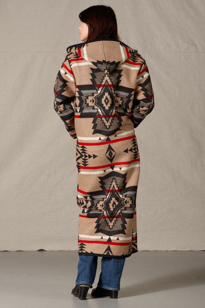 Long Pendleton wool coat, mostly tan with black geometric shapes and red accents.