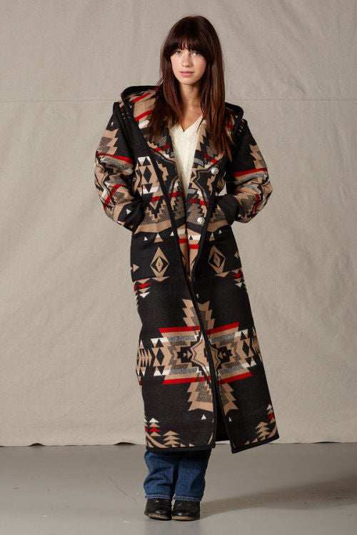 Long Pendleton wool coat, mostly black with tan geometric shapes and red accents.