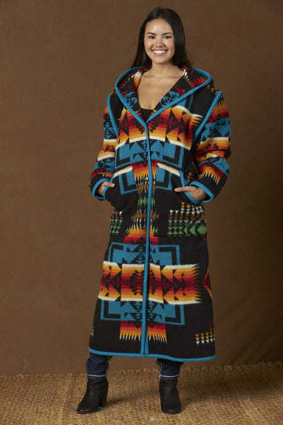 Long wool coat, black with turquoise, red and orange geometric accents in Chief Joseph pattern by Pendleton.