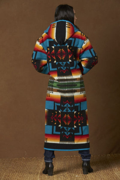Long wool coat, black with turquoise, red and orange geometric accents in Chief Joseph pattern by Pendleton.