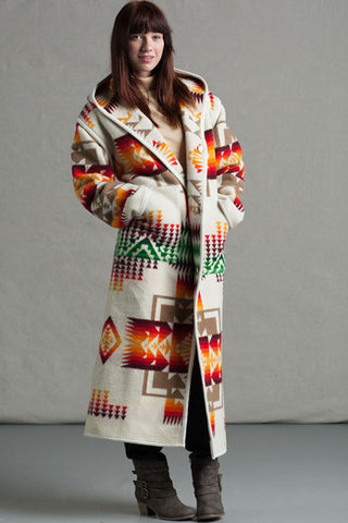 Long wool coat, ivory with tan, red, orange and green geometric accents in Chief Joseph pattern by Pendleton.