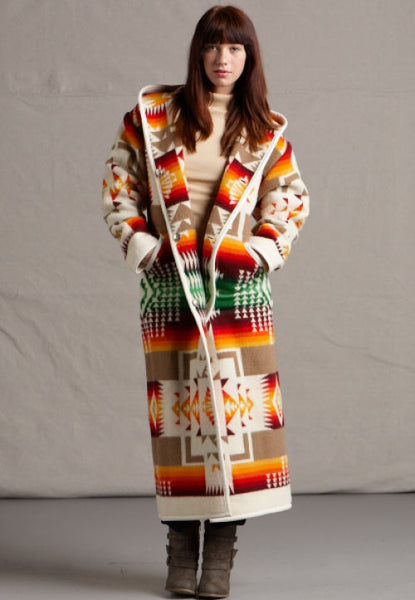 Long wool coat, ivory with tan, red, orange and green geometric accents in Chief Joseph pattern by Pendleton.
