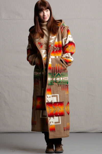 Long wool coat, khaki-brown, with ivory, red and orange geometric accents in Chief Joseph pattern by Pendleton.